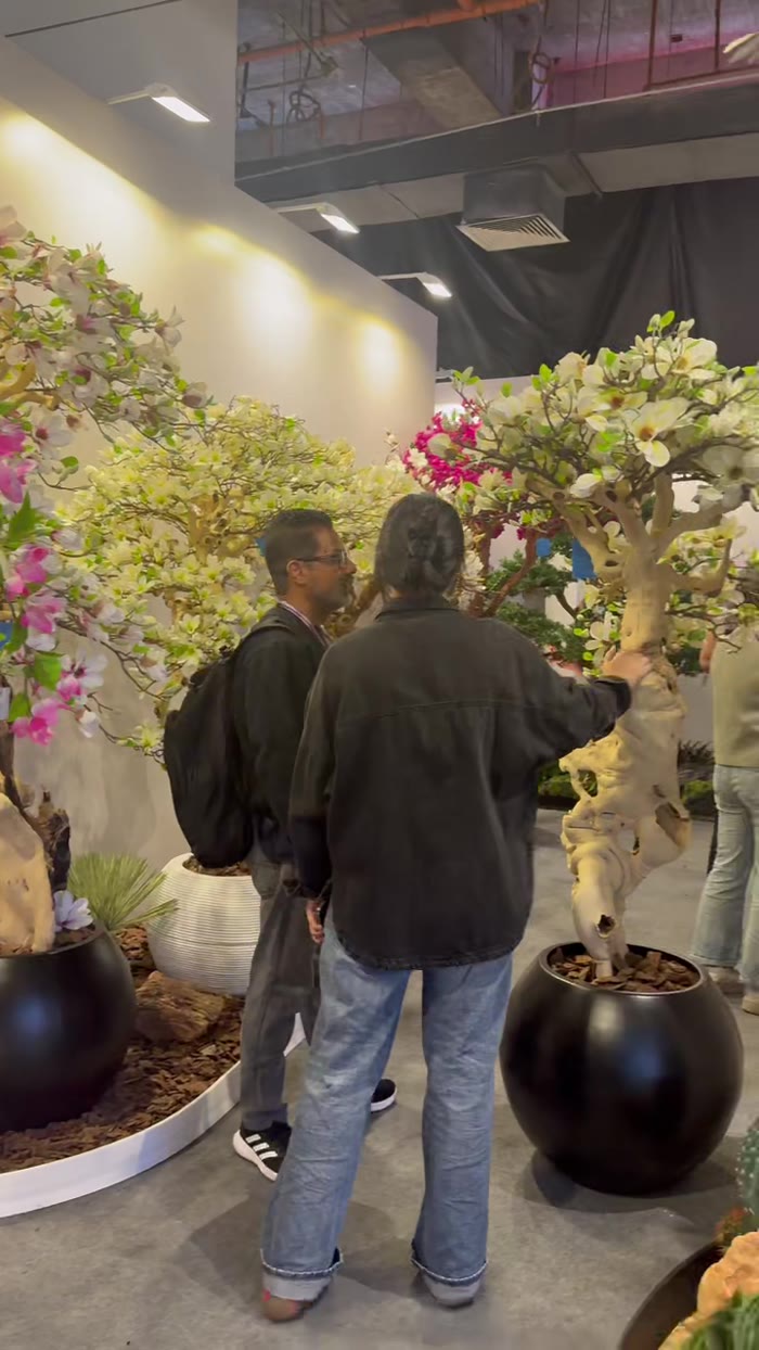 Client viewing flowering trees in the TaoYuan showroom
