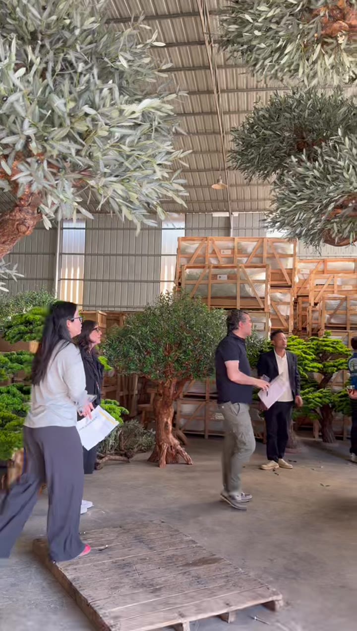 Visitors touching artificial trees at TaoYuan